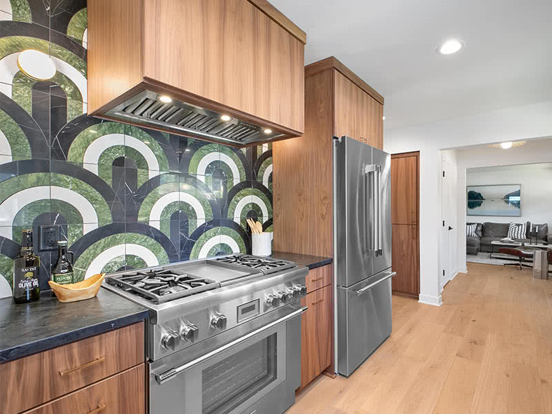 Flat panel walnut cabinets in this Midcentury Modern home remodel in Camas, WA.