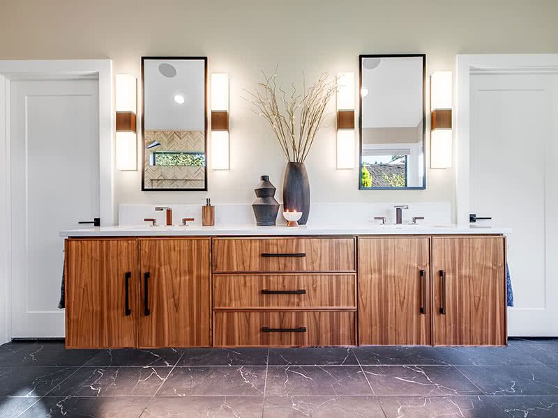 Floating walnut vanity in primary bathroom in Portland, Oregon