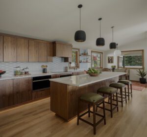 Midcentury kitchen remodel with walnut cabinetry and oversized island. 